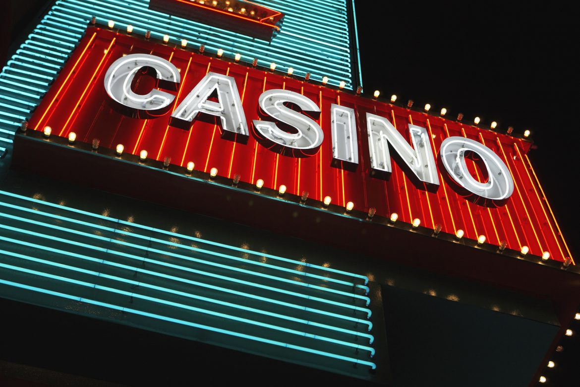 9887604_neon-casino-sign-at-night-low-angle-view neon casino sign