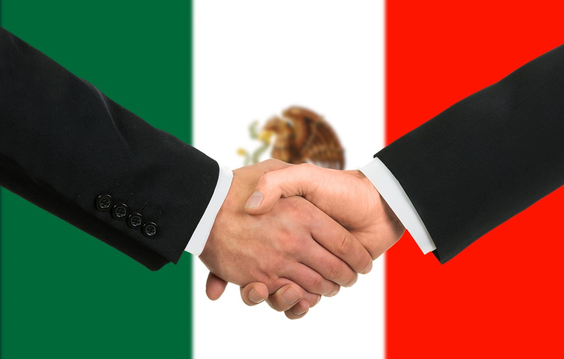 Two Mexican businessmen shaking hands