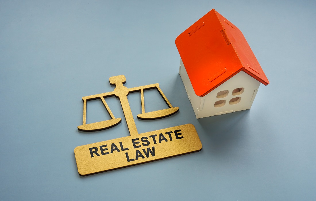 model-of-the-house-and-a-sign-real-estate-law